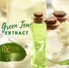 A close-up of green tea leaf, bottles of green tea extract, skincare product containing green tea extract, the plant from which green tea extract is derived
